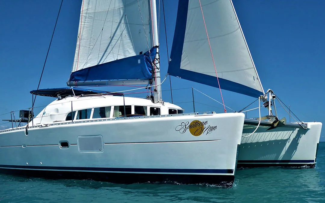 Sailing catamaran in the water front 3/4 view