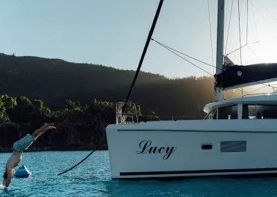 Man diving off anchored boat
